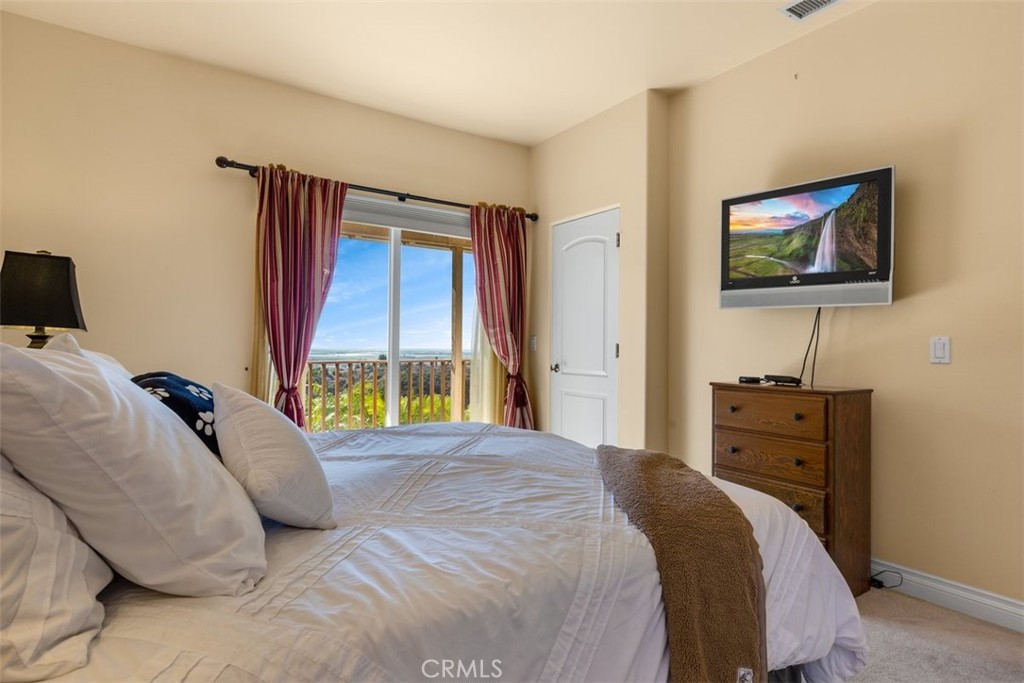 77 Altamont Way Camarillo, CA 93010 - Photo 22 of 48 a bedroom with a bed and a flat screen tv