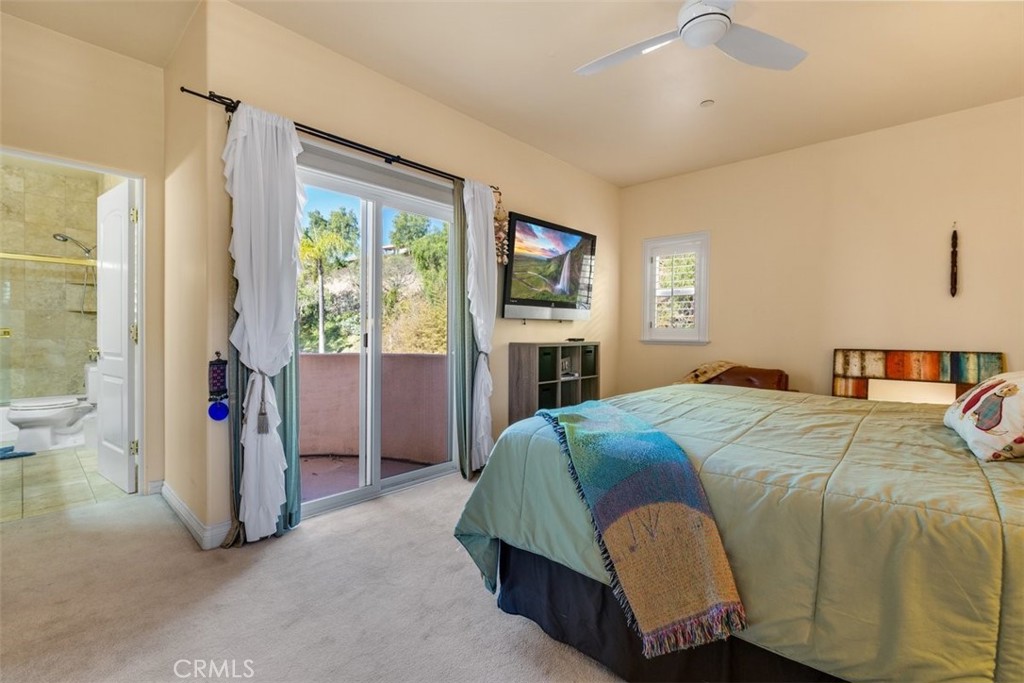 77 Altamont Way Camarillo, CA 93010 - Photo 23 of 48 a bedroom with a bed and a chandelier
