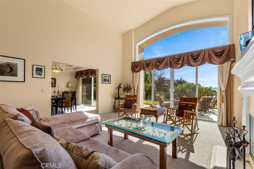 77 Altamont Way Camarillo, CA 93010 - Photo 29 of 48 a living room with furniture a fireplace and large windows