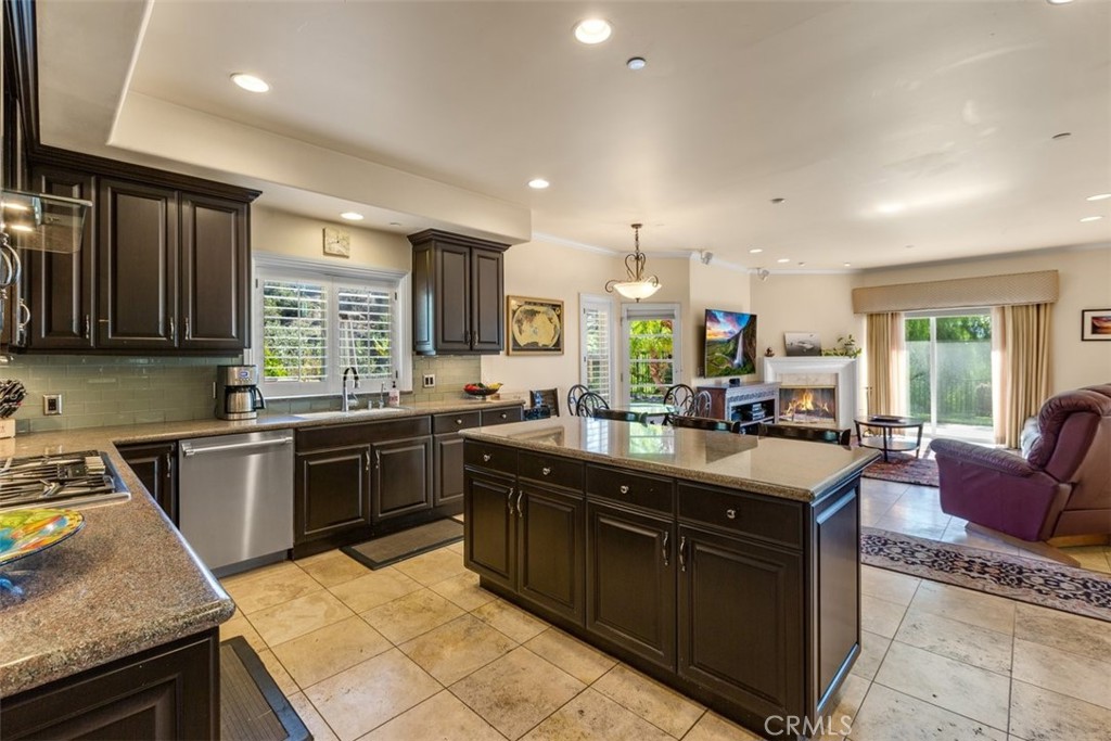 77 Altamont Way Camarillo, CA 93010 - Photo 9 of 48 a kitchen with stainless steel appliances granite countertop a sink stove and cabinets