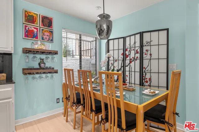 a view of a palm tree with flower plants