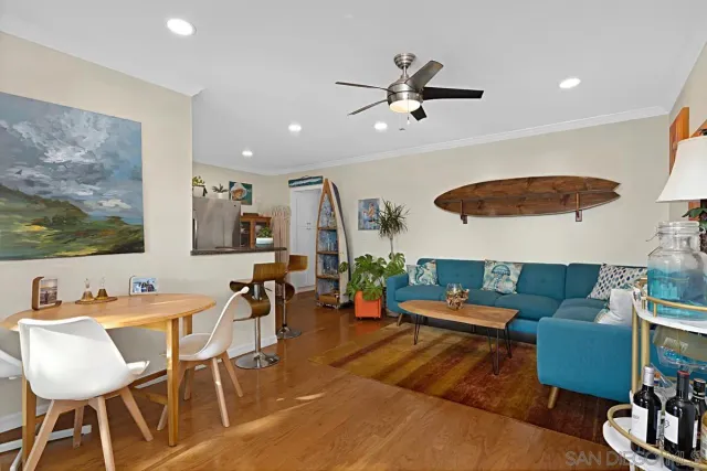 a view of a dining room with furniture and wooden floor