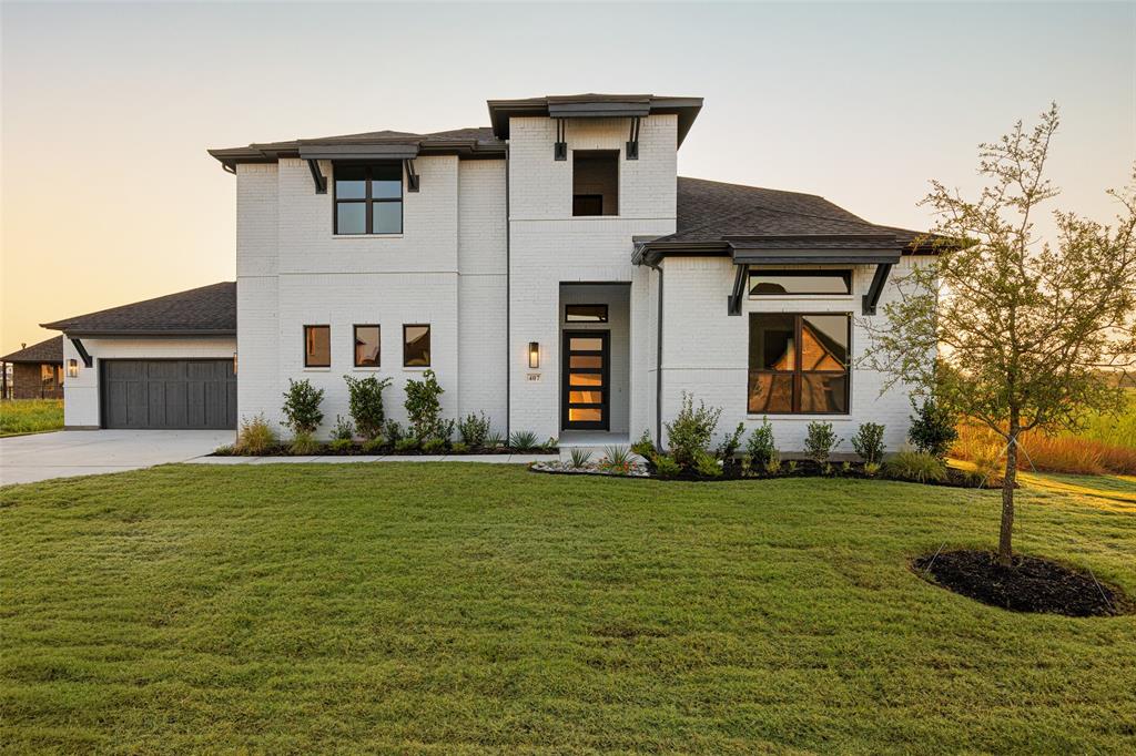 a front view of a house with a yard