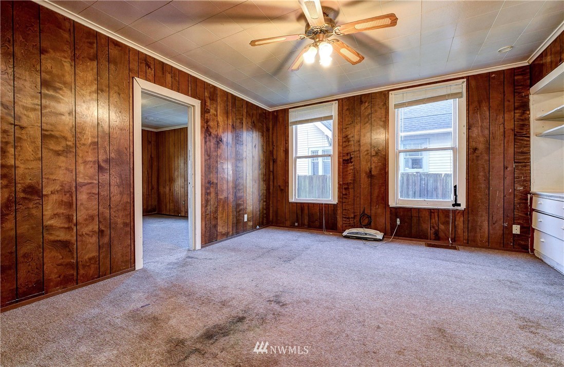 3618 Rucker Avenue Everett, WA 98201 - Photo 11 of 33 an empty room with windows and fan