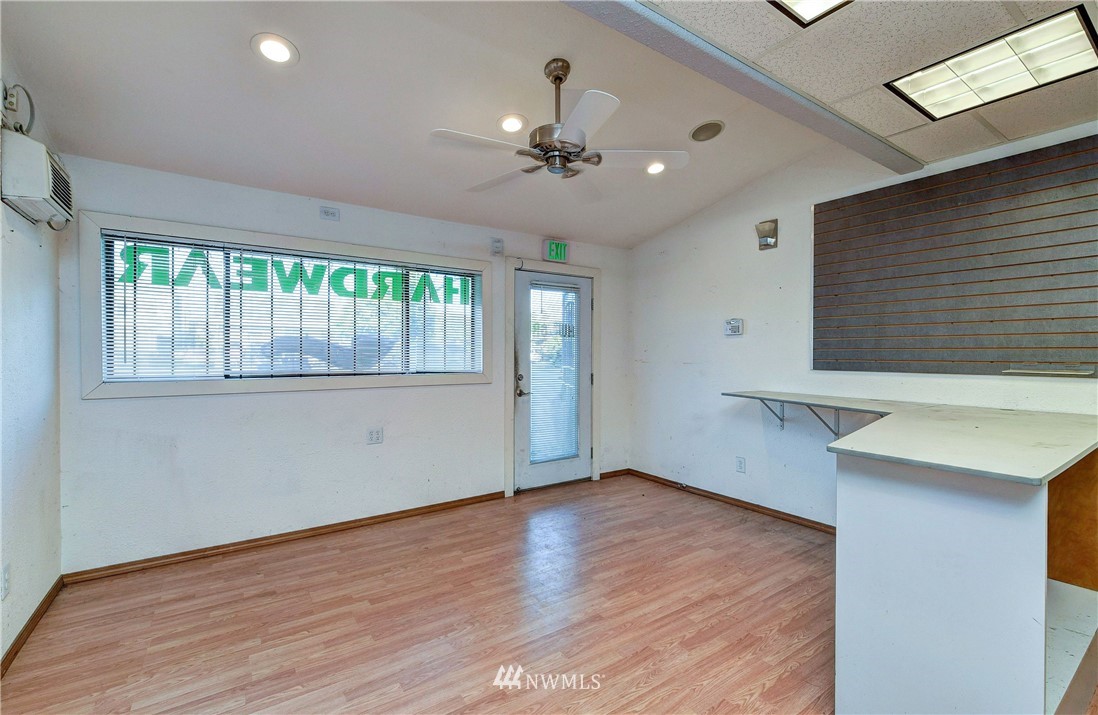 3618 Rucker Avenue Everett, WA 98201 - Photo 25 of 33 a view of an empty room with wooden floor and a window