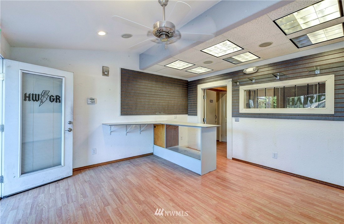 3618 Rucker Avenue Everett, WA 98201 - Photo 26 of 33 a view of an empty room with wooden floor and a window
