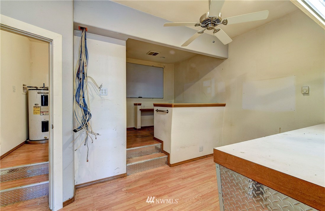 3618 Rucker Avenue Everett, WA 98201 - Photo 27 of 33 a view of empty room with wooden floor and fan