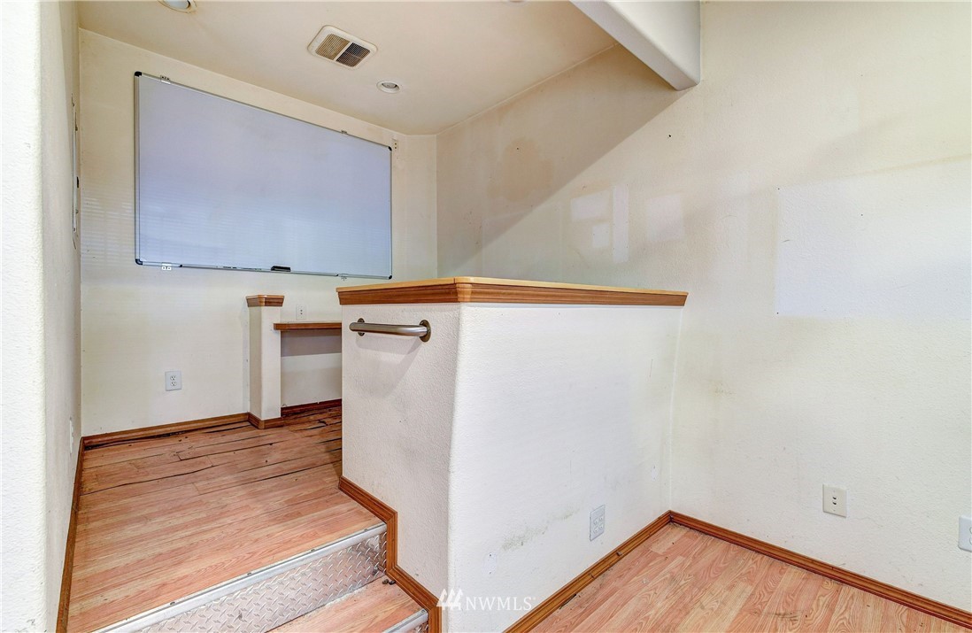 3618 Rucker Avenue Everett, WA 98201 - Photo 30 of 33 a view of a storage & utility room with wooden floor