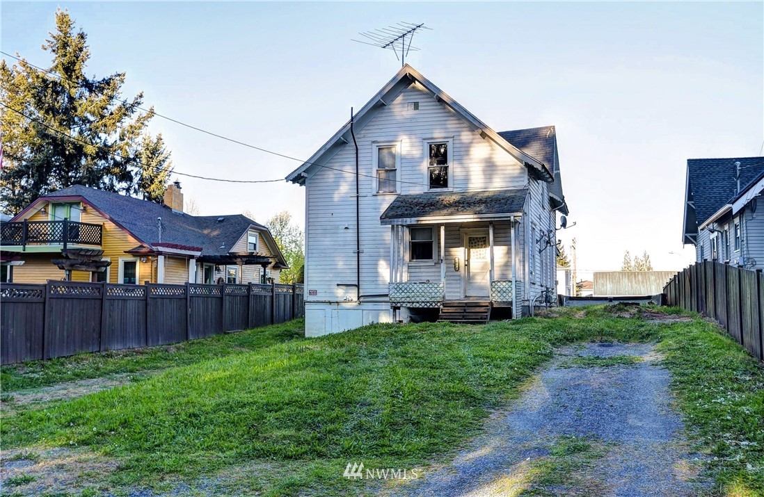 3618 Rucker Avenue Everett, WA 98201 - Photo 7 of 33 a front view of a house with a yard and trees