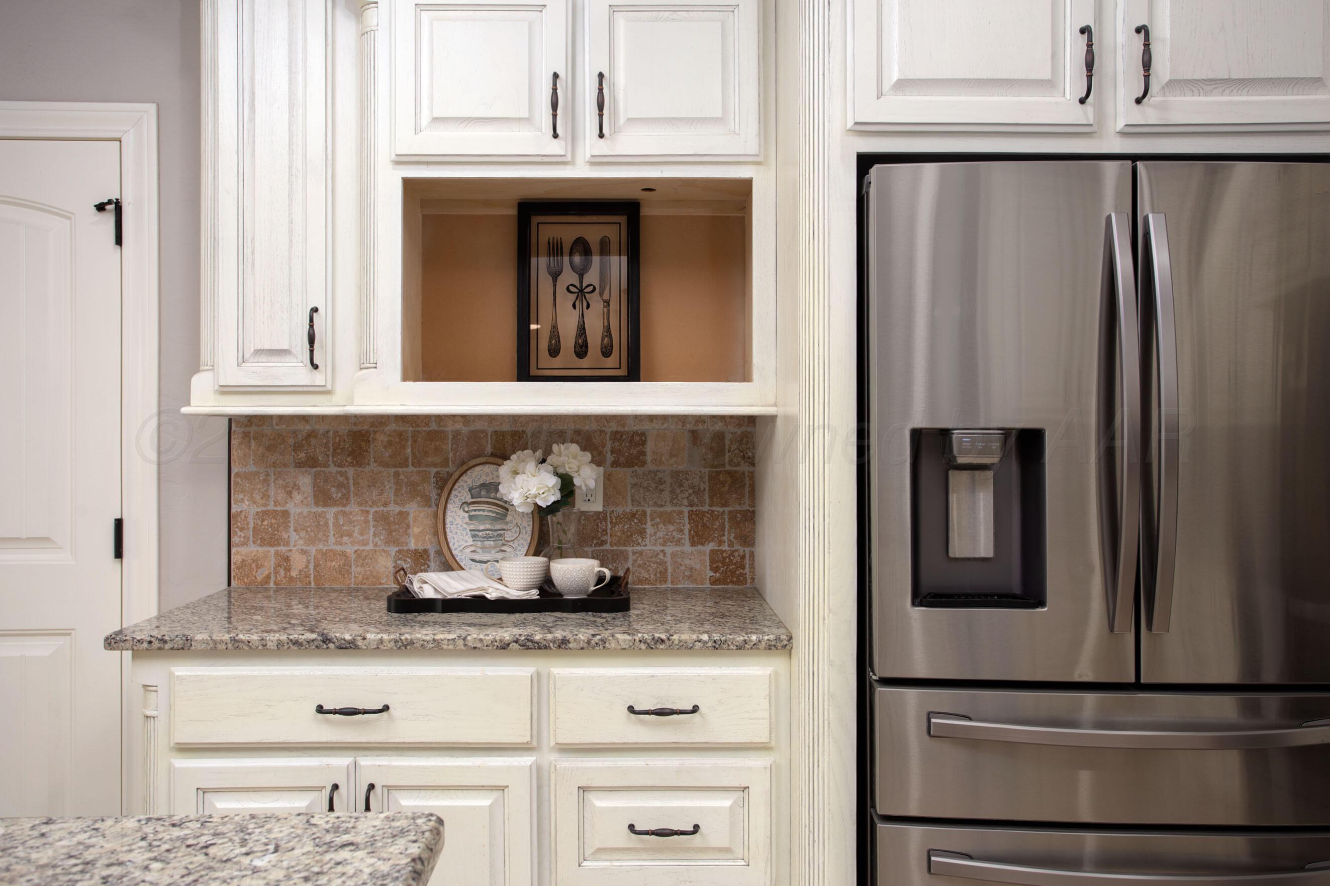9551 Yesterday Lane Amarillo, TX 79119 - Photo 14 of 53 a kitchen with granite countertop stainless steel appliances and refrigerator