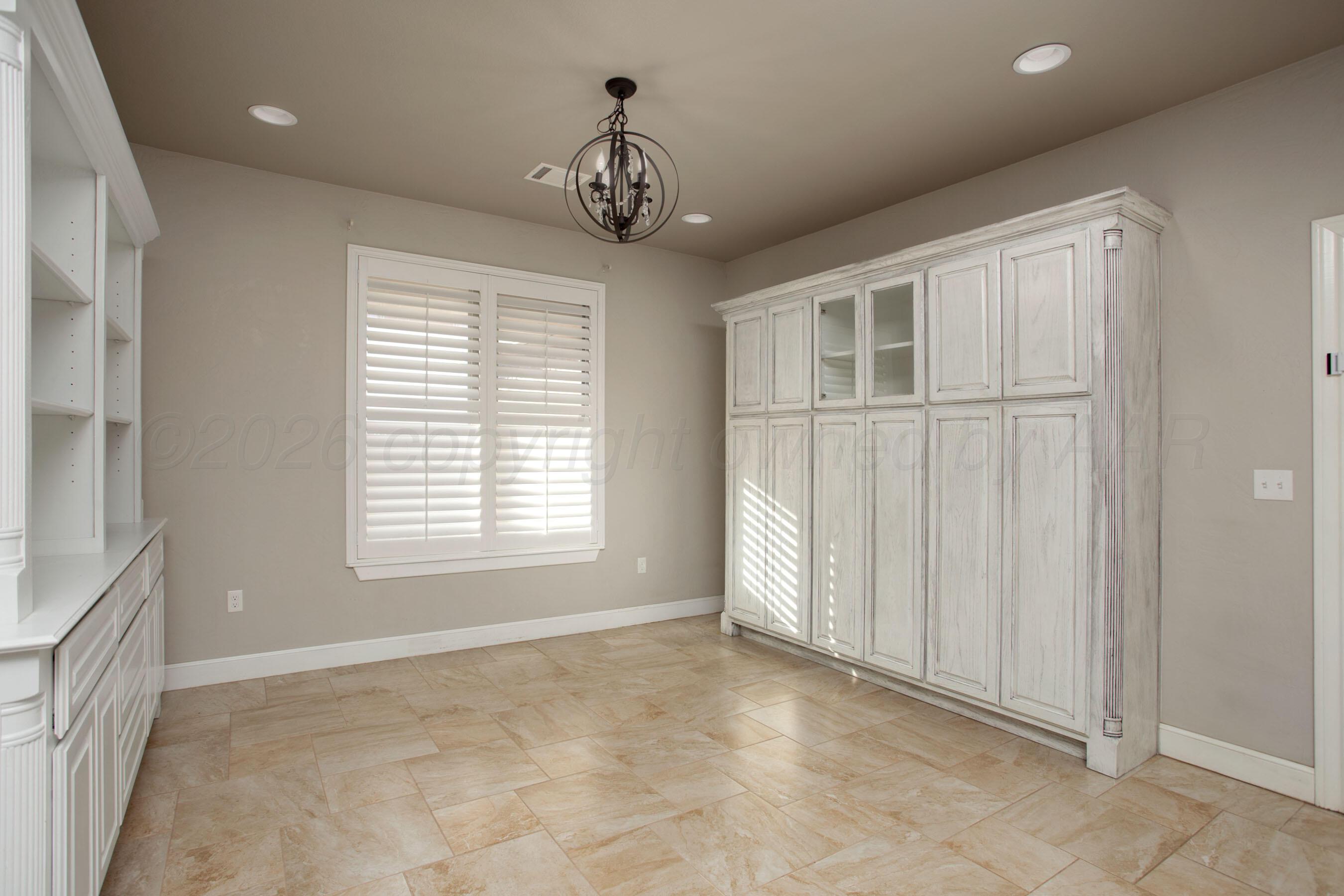 9551 Yesterday Lane Amarillo, TX 79119 - Photo 18 of 53 an empty room with chandelier fan and windows