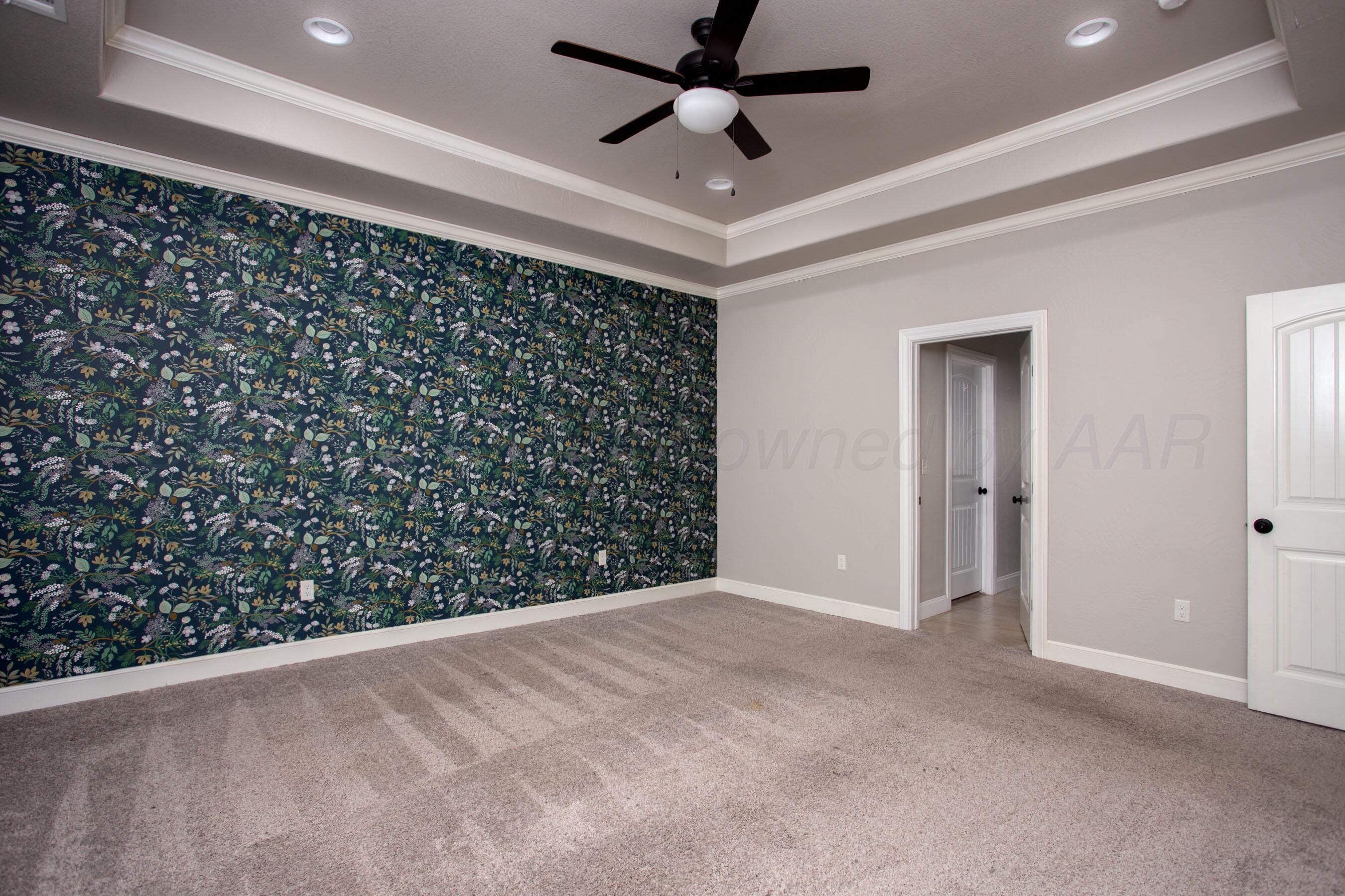 9551 Yesterday Lane Amarillo, TX 79119 - Photo 21 of 53 a view of an empty room and a ceiling fan