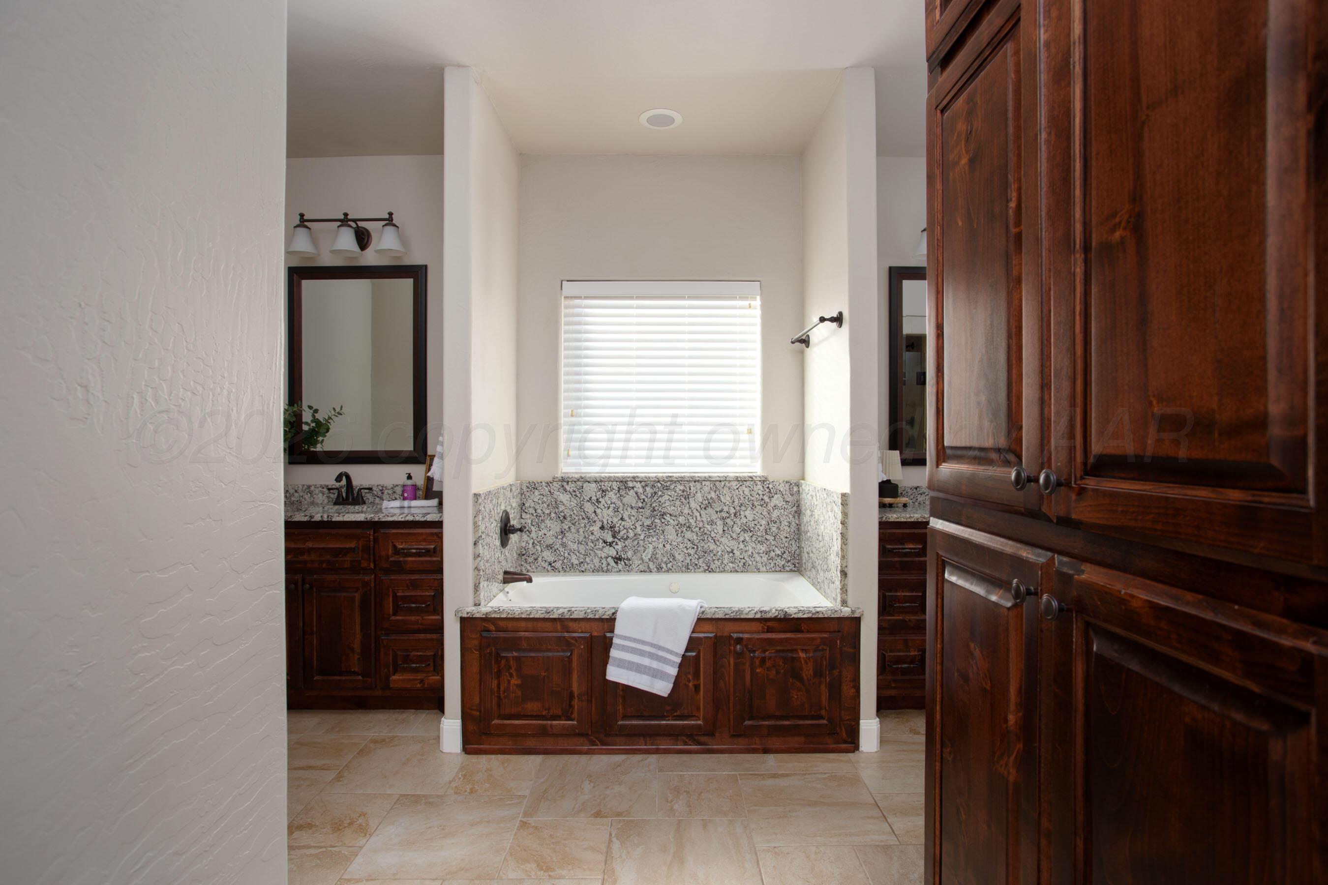 9551 Yesterday Lane Amarillo, TX 79119 - Photo 22 of 53 a bedroom with a bed and dresser