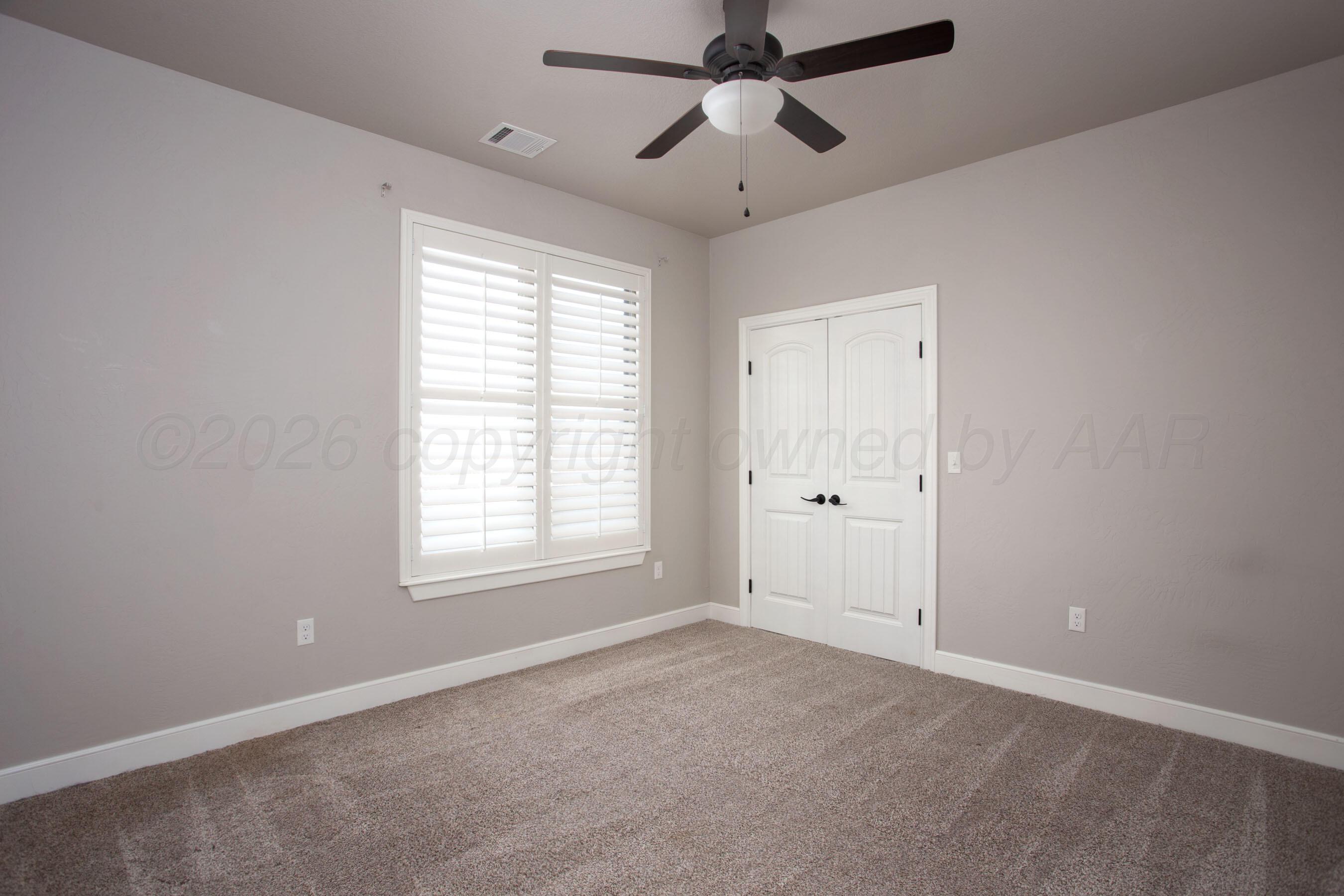 9551 Yesterday Lane Amarillo, TX 79119 - Photo 30 of 53 en empty room with windows and ceiling fan