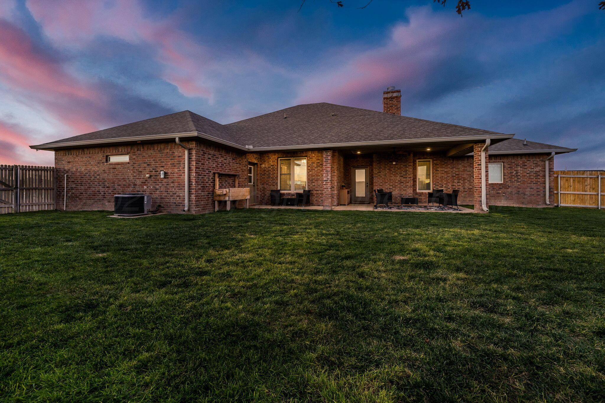 9551 Yesterday Lane Amarillo, TX 79119 - Photo 37 of 53 a front view of a house with a yard