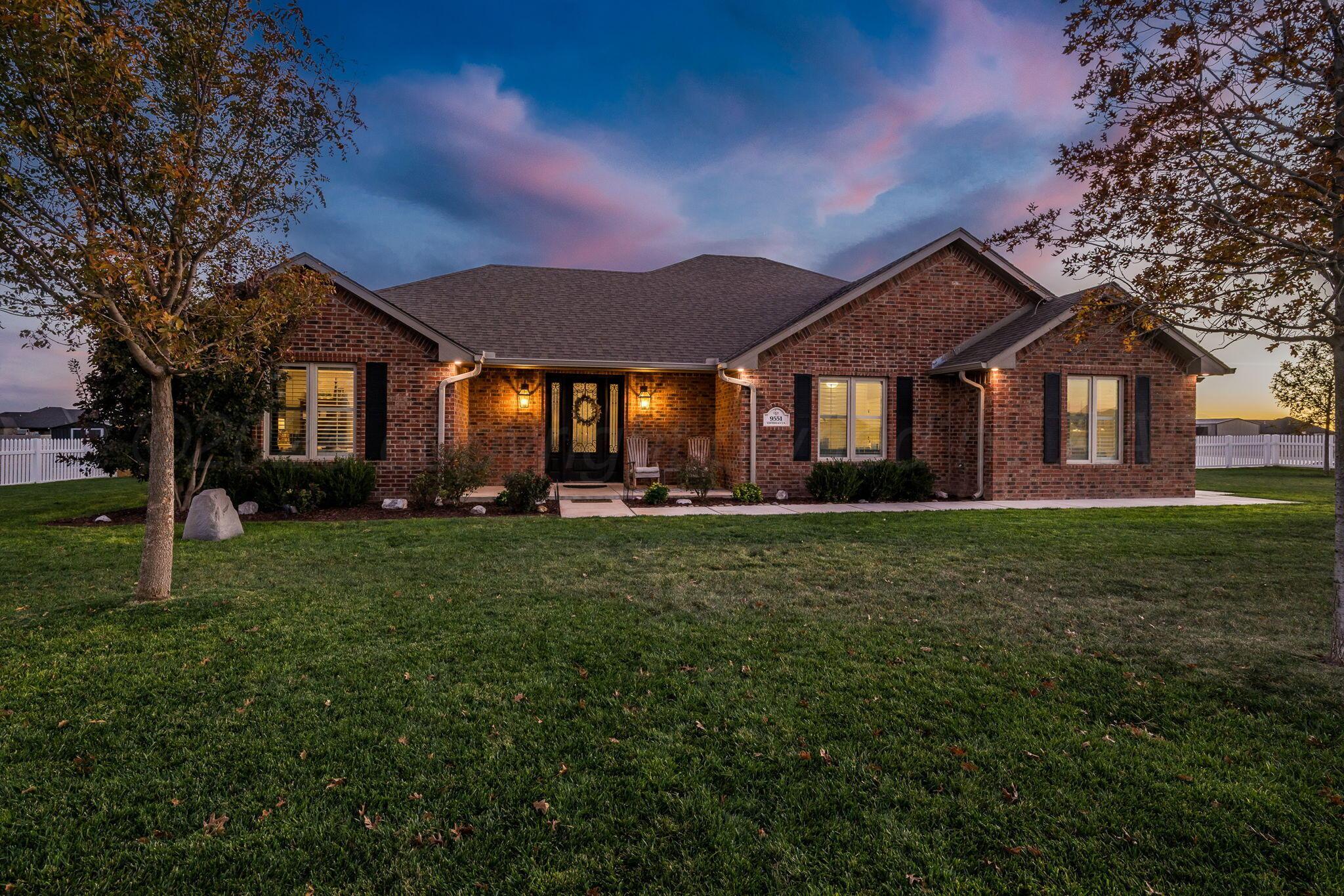 9551 Yesterday Lane Amarillo, TX 79119 - Photo 4 of 53 front view of a house with a yard