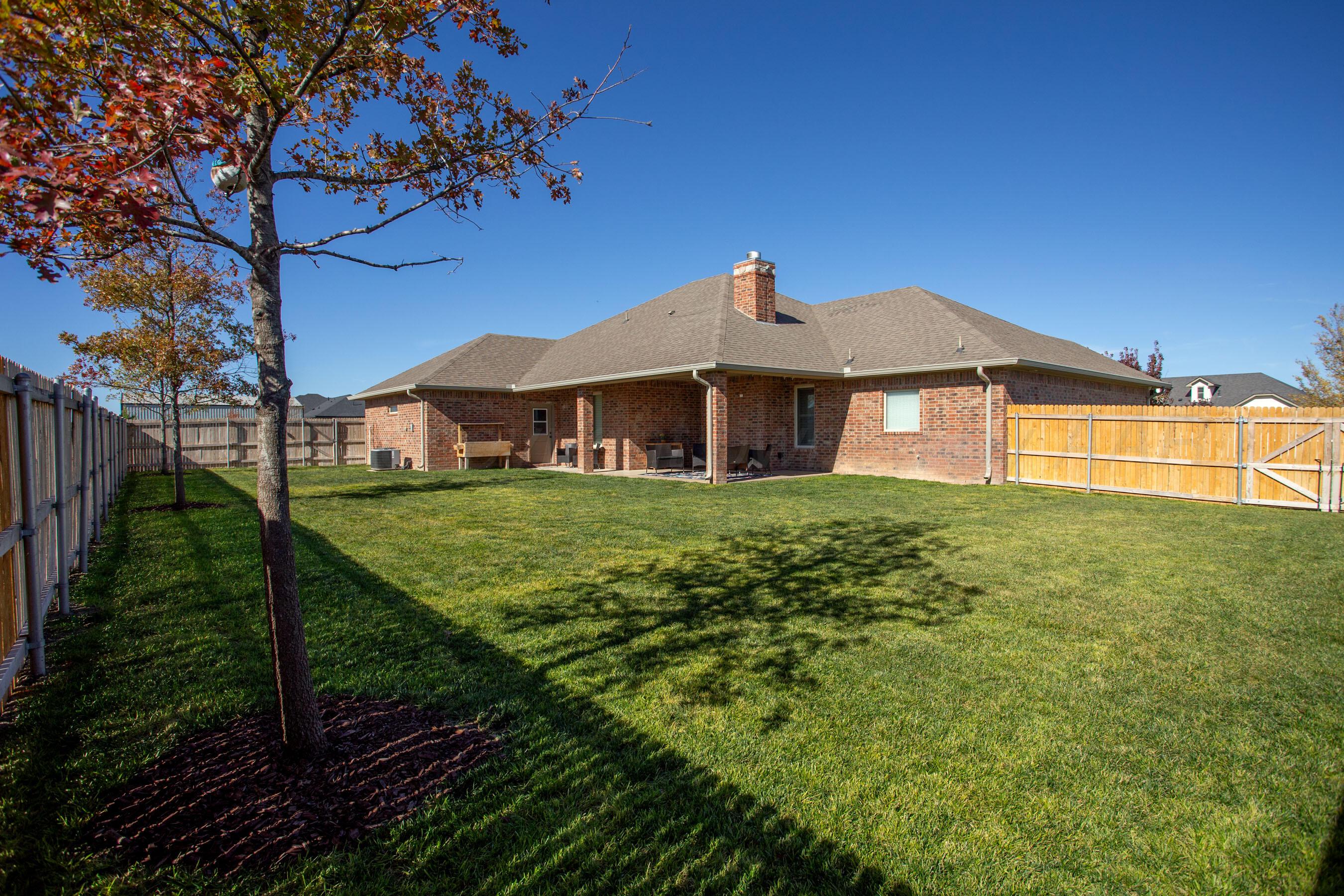 9551 Yesterday Lane Amarillo, TX 79119 - Photo 41 of 53 a front view of a house with garden