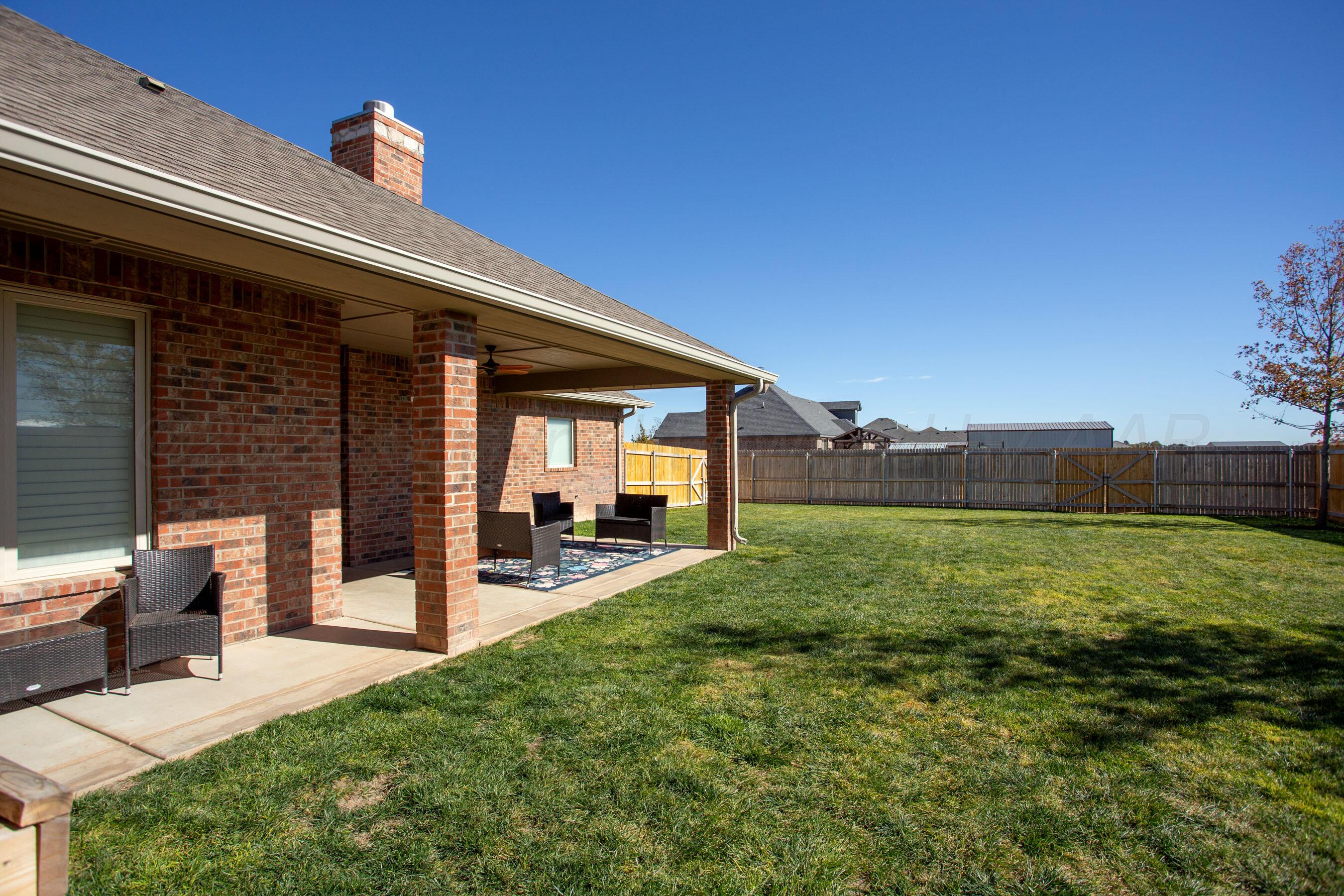 9551 Yesterday Lane Amarillo, TX 79119 - Photo 46 of 53 a view of a backyard with table and chairs and potted plants