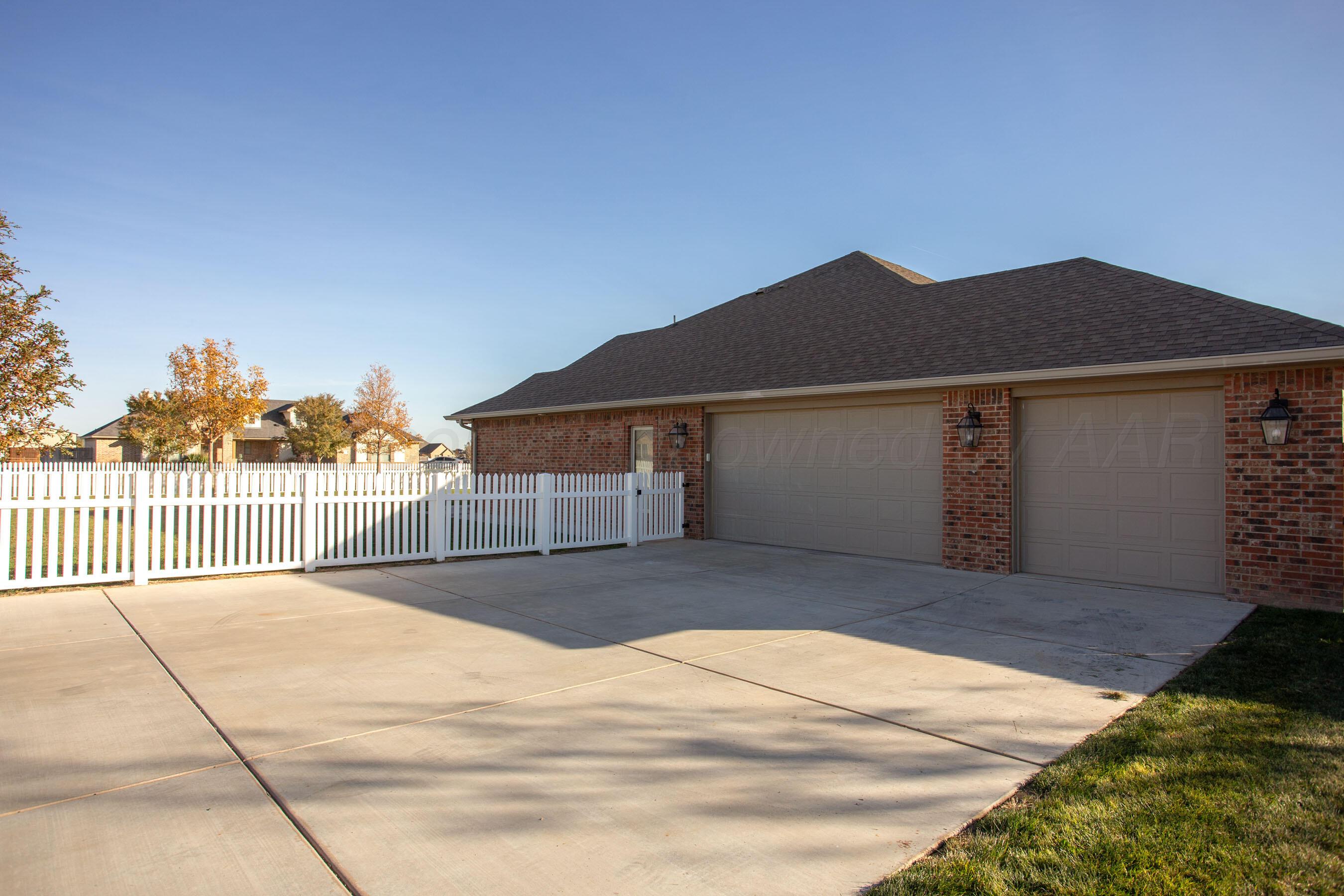 9551 Yesterday Lane Amarillo, TX 79119 - Photo 49 of 53 a view of a house with a backyard