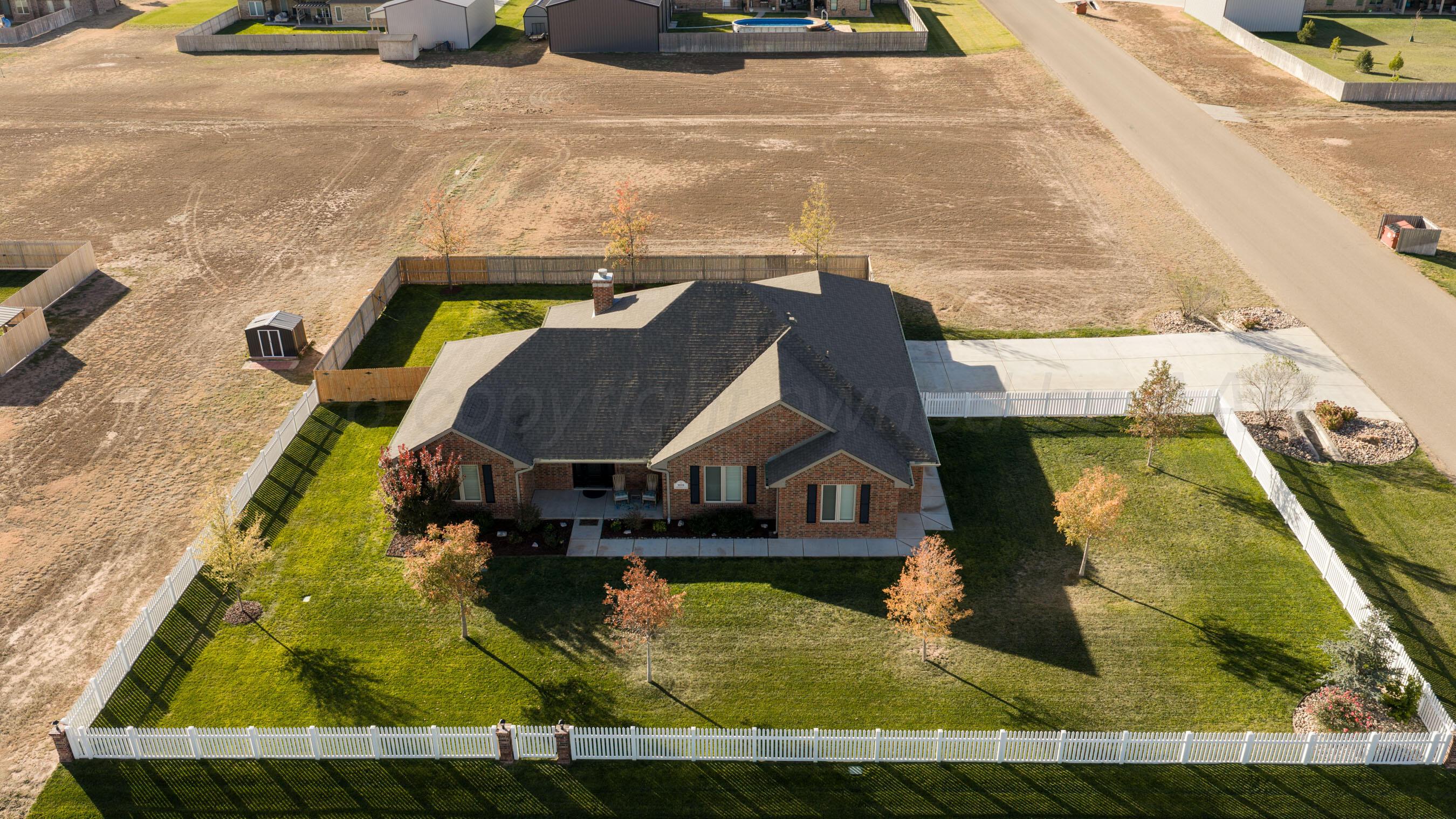9551 Yesterday Lane Amarillo, TX 79119 - Photo 5 of 53 an aerial view of a house with a swimming pool