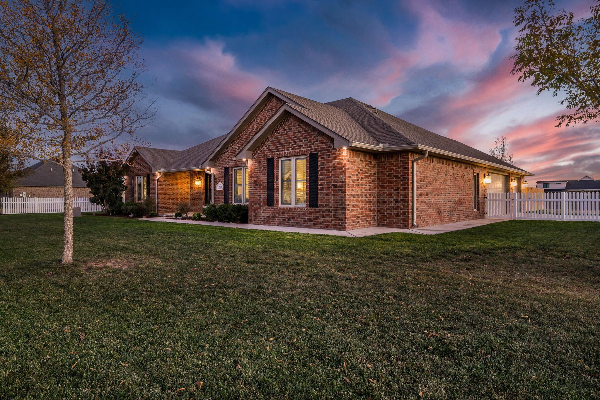 9551 Yesterday Lane Amarillo, TX 79119 - Photo 6 of 53 a front view of a house with a yard