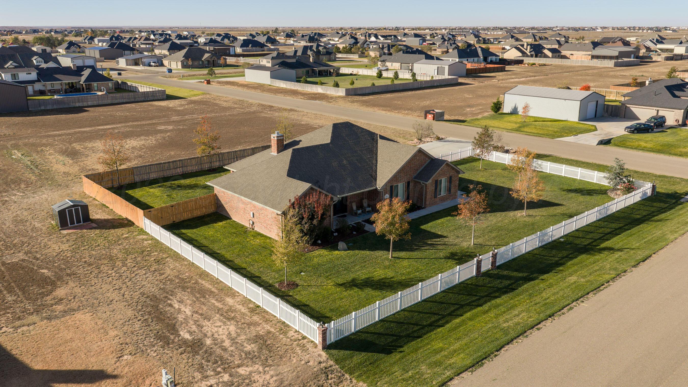 9551 Yesterday Lane Amarillo, TX 79119 - Photo 7 of 53 an aerial view of residential houses with outdoor space