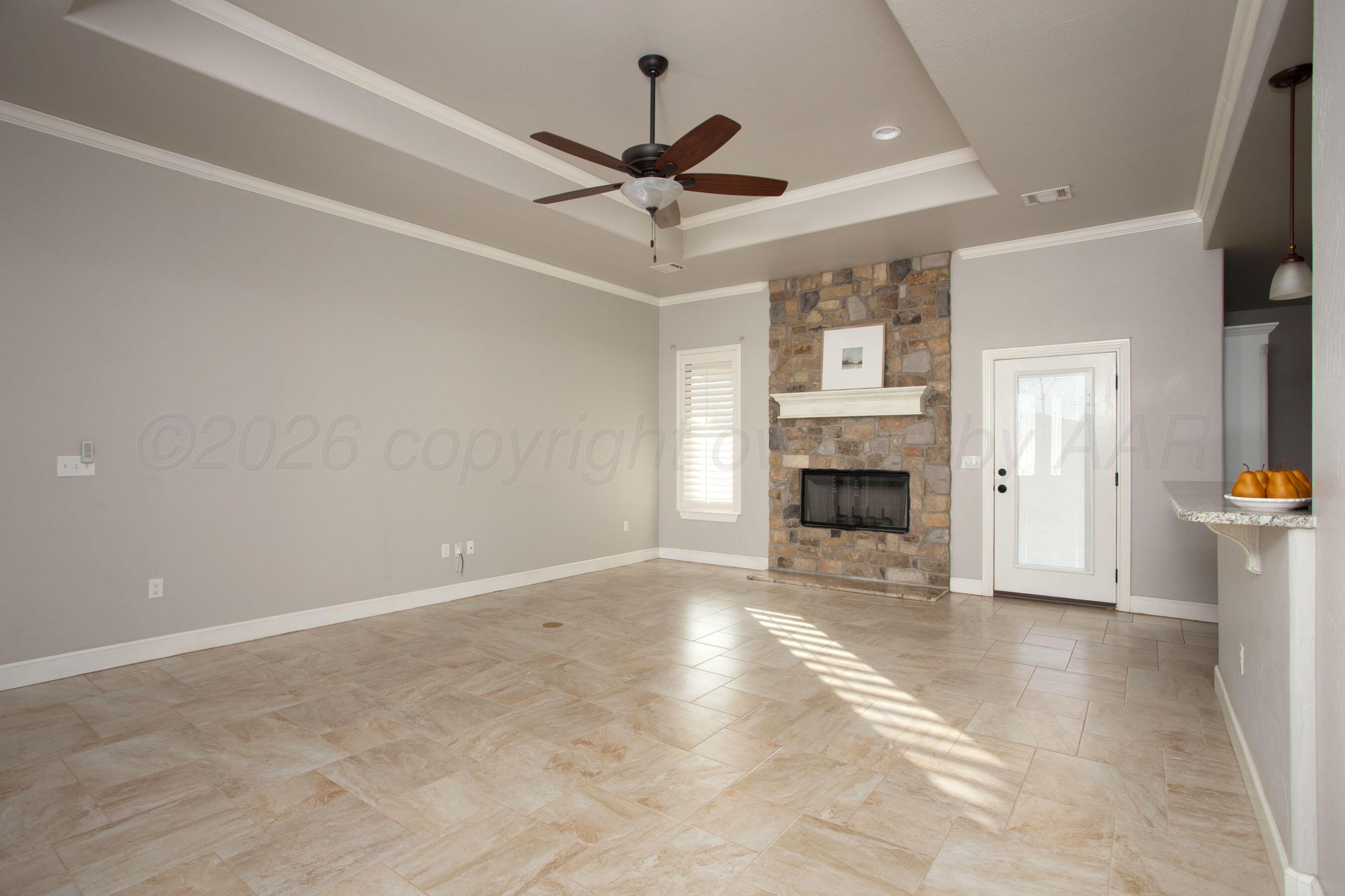 9551 Yesterday Lane Amarillo, TX 79119 - Photo 10 of 53 a view of a livingroom with a fireplace and window