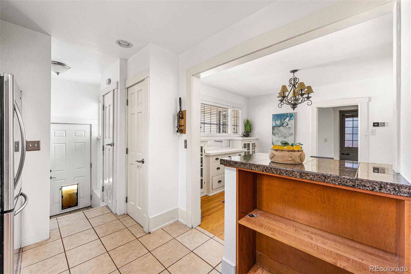 954 Jackson Street Denver, CO 80206 - Photo 11 of 37 a spacious bathroom with a granite countertop sink mirror and a bathtub