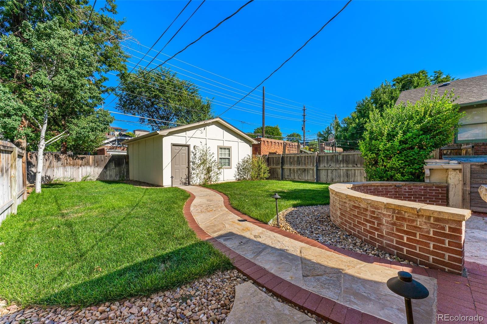 954 Jackson Street Denver, CO 80206 - Photo 24 of 37 a view of a house with backyard and sitting area