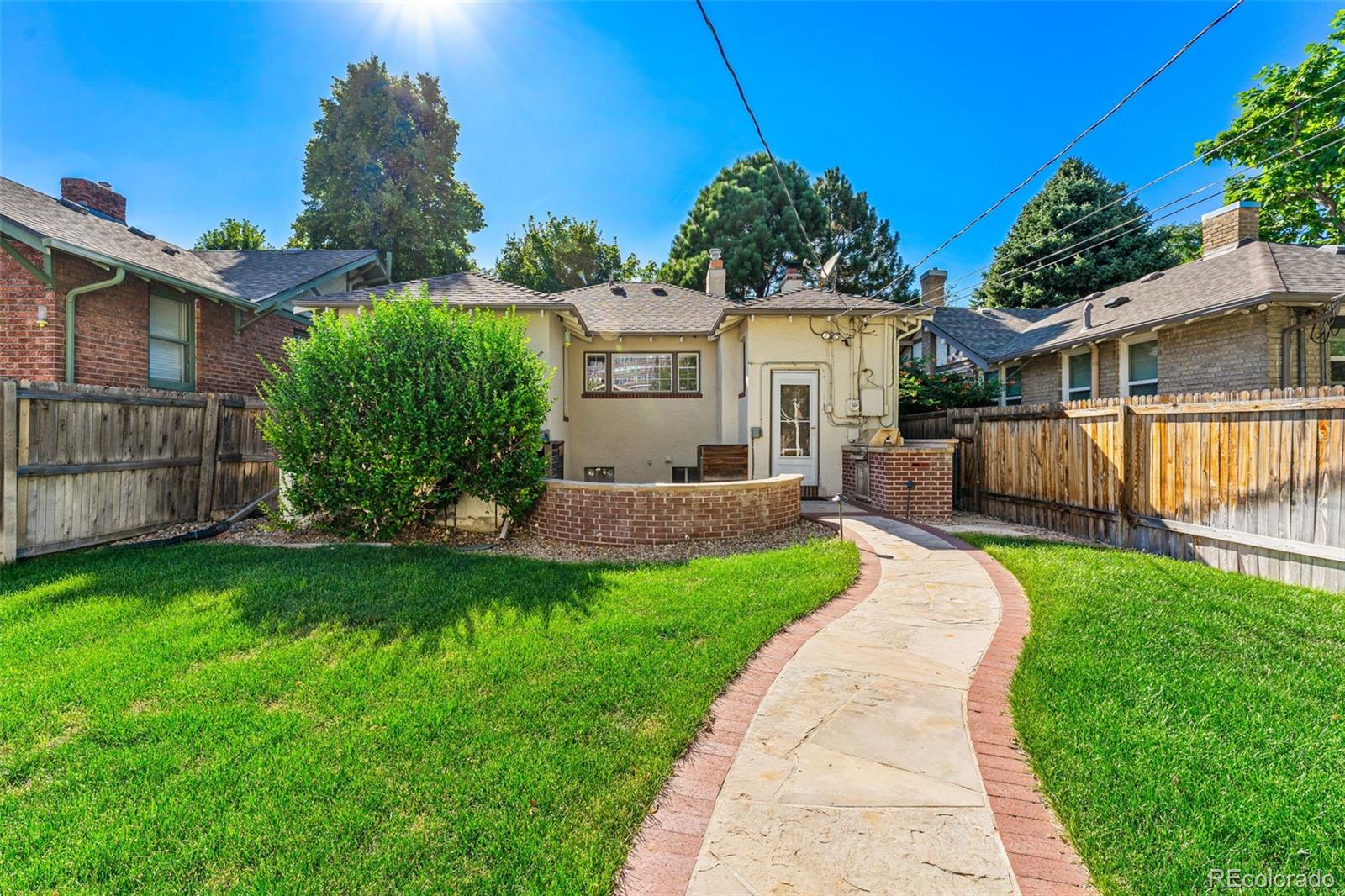 954 Jackson Street Denver, CO 80206 - Photo 26 of 37 a view of a yard in front of a house