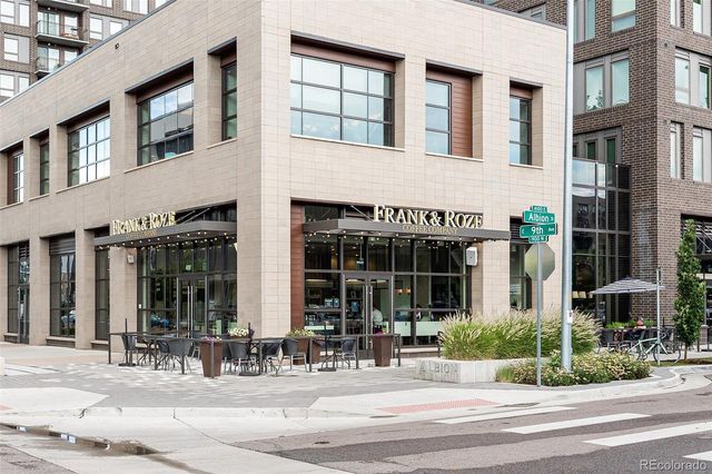 a view of a building with sitting area