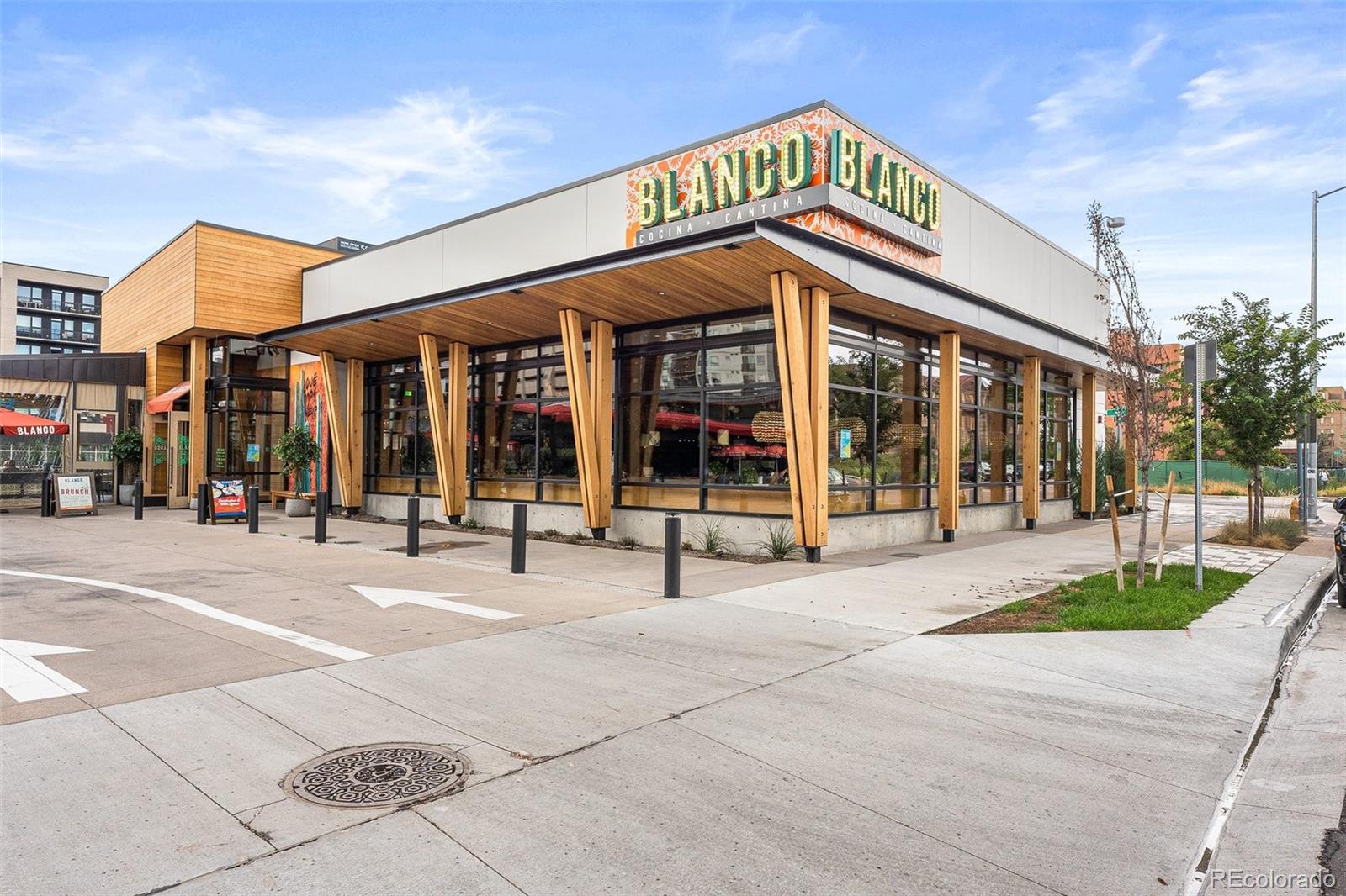 954 Jackson Street Denver, CO 80206 - Photo 31 of 37 a building with sign broad