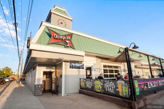 a view of a building with retail shops