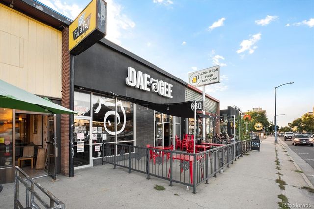 a view of a cafe with sitting area and furniture