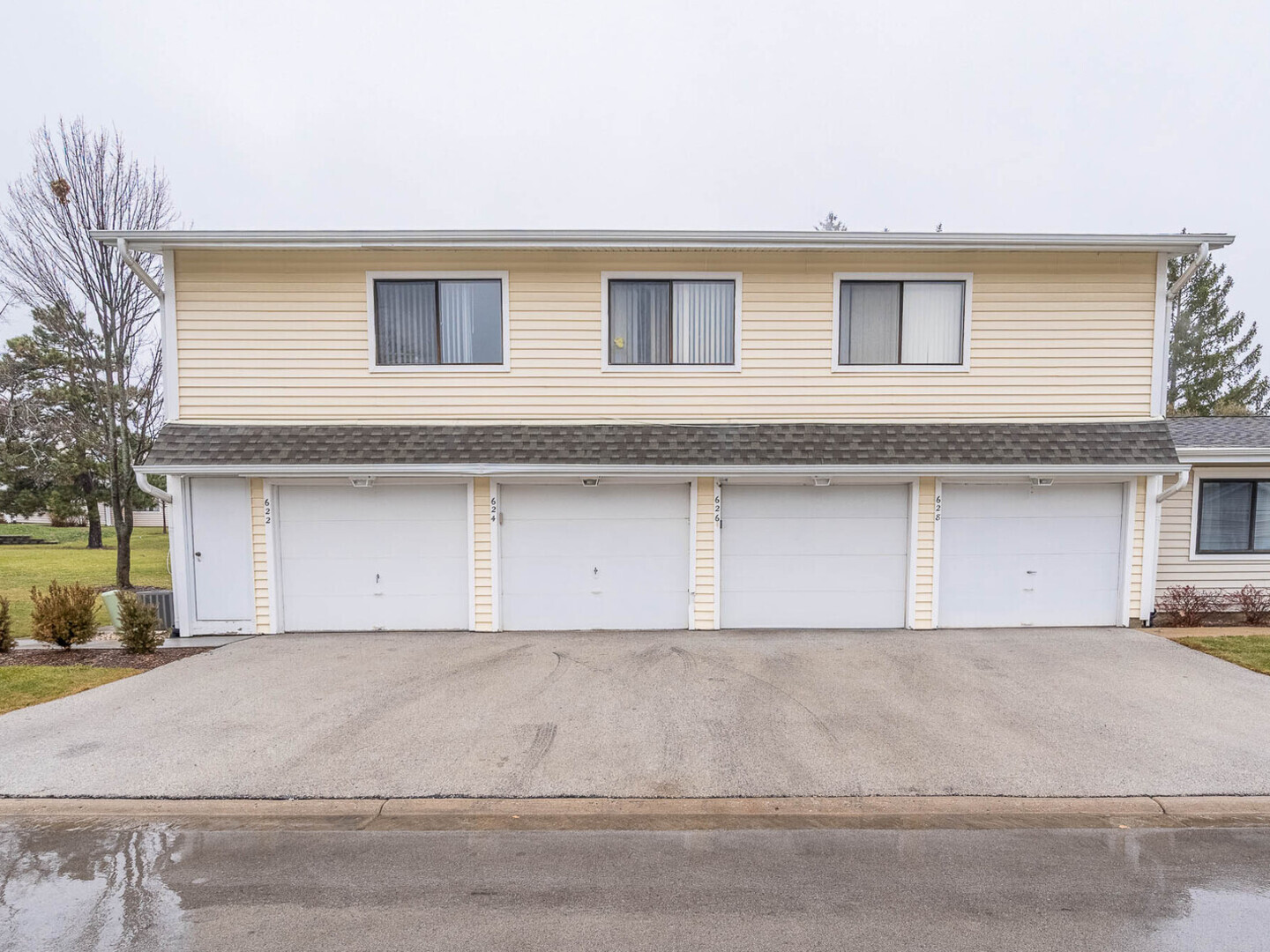 a front view of a house with garage