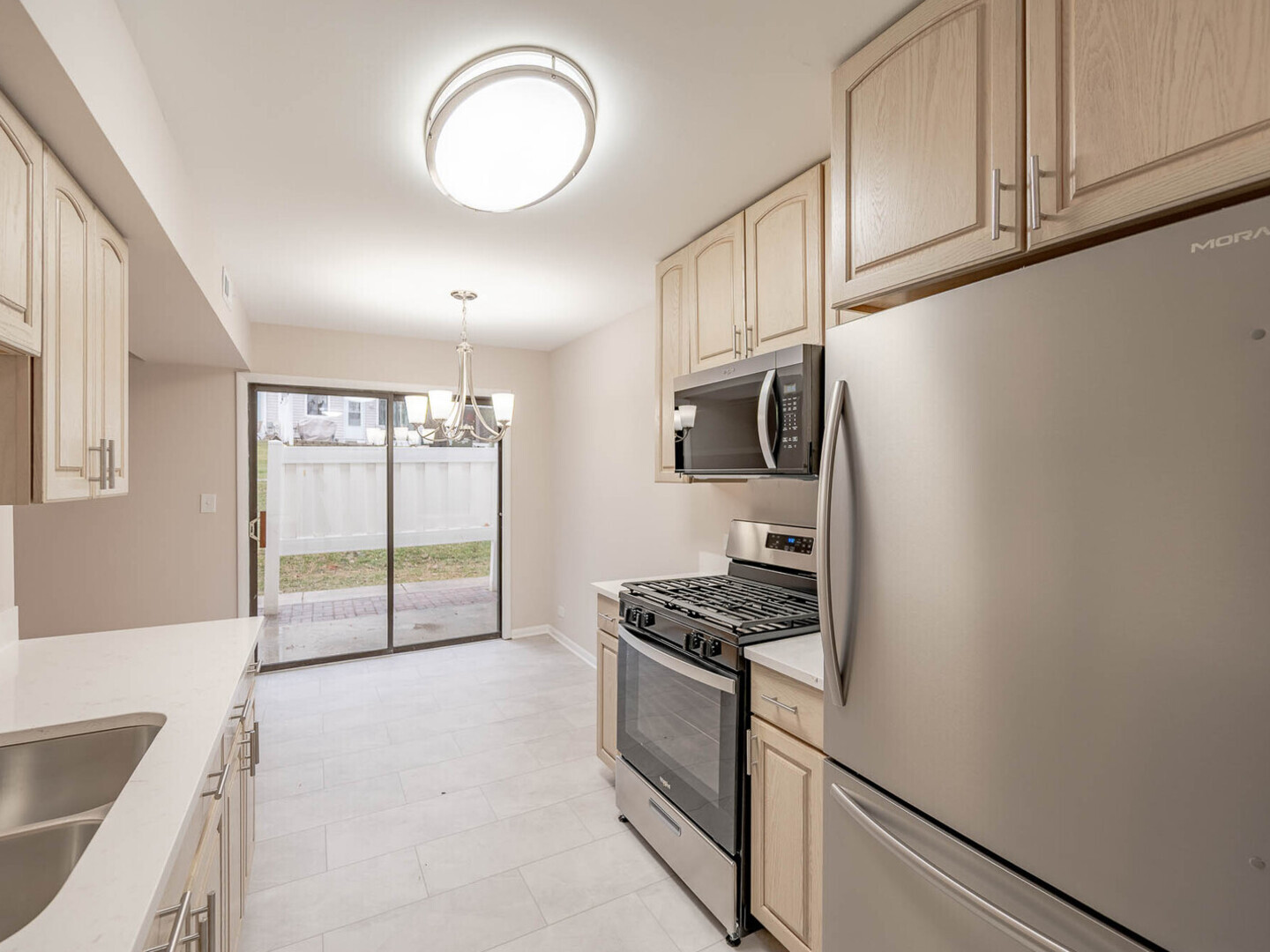 624 Breakers Point, Unit 624 Schaumburg, IL 60194 - Photo 6 of 13 a kitchen with granite countertop cabinets and steel stainless steel appliances