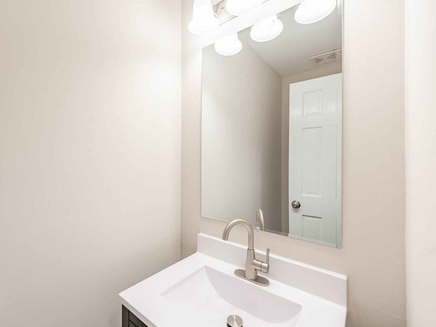 624 Breakers Point, Unit 624 Schaumburg, IL 60194 - Photo 7 of 13 a bathroom with a sink and a mirror