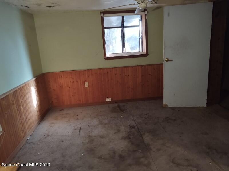 228 Capron Road Cocoa, FL 32927 - Photo 8 of 12 an empty room with windows