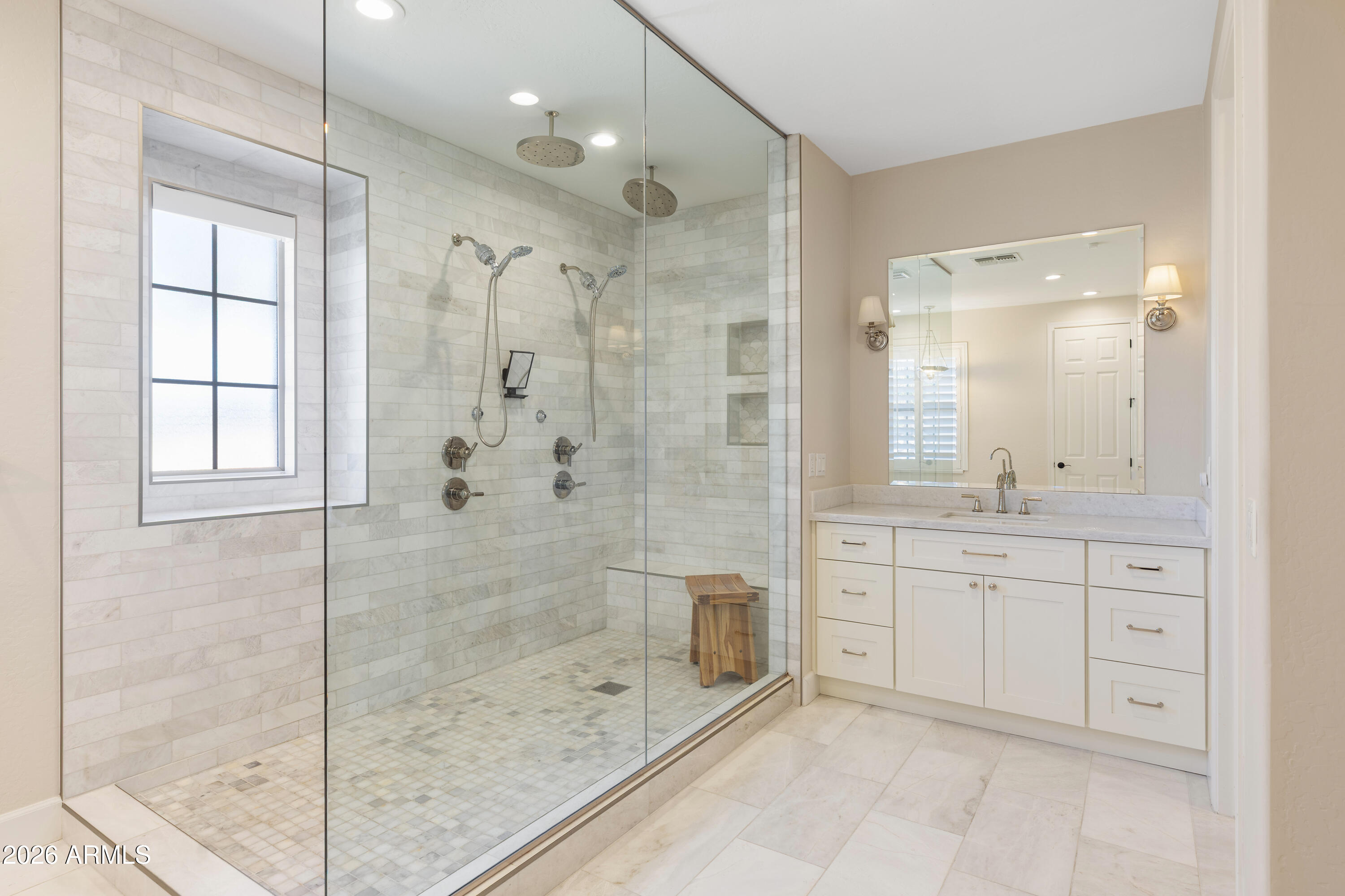 2517 South Constellation Way Gilbert, AZ 85295 - Photo 20 of 47 a bathroom with a shower sink and mirror