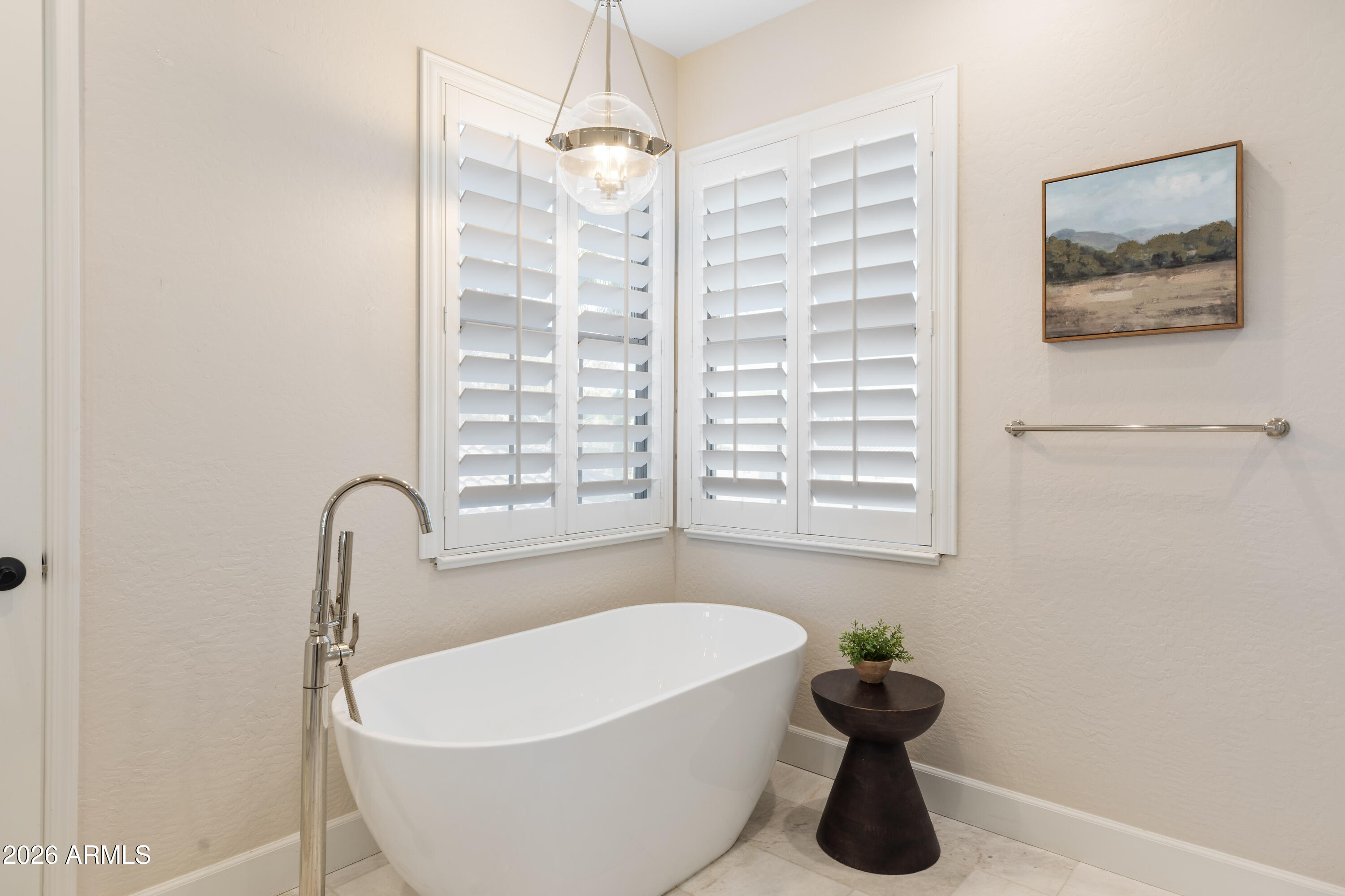 2517 South Constellation Way Gilbert, AZ 85295 - Photo 21 of 47 a bathroom with a sink a bathtub and window
