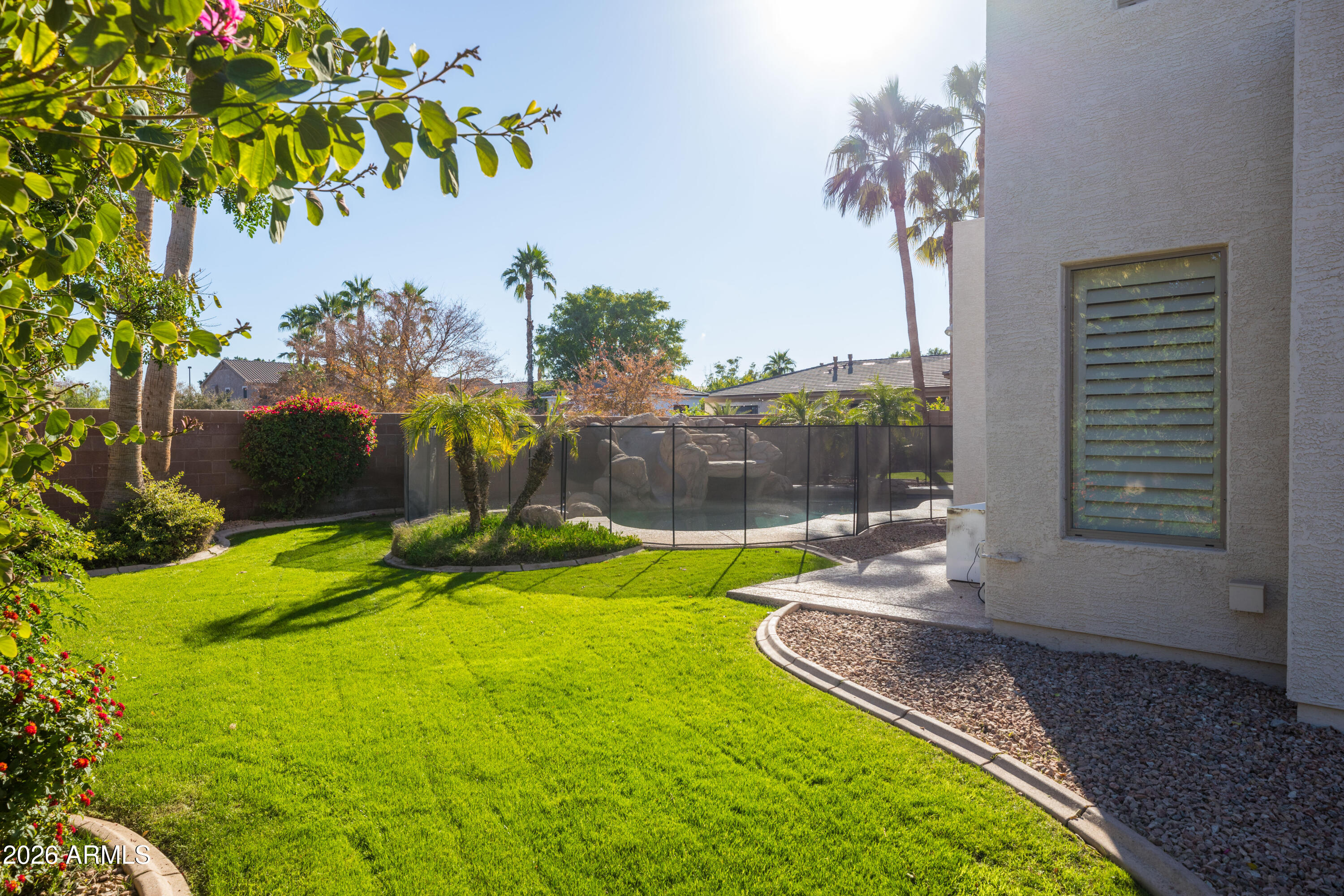 2517 South Constellation Way Gilbert, AZ 85295 - Photo 44 of 47 a view of a backyard with a garden
