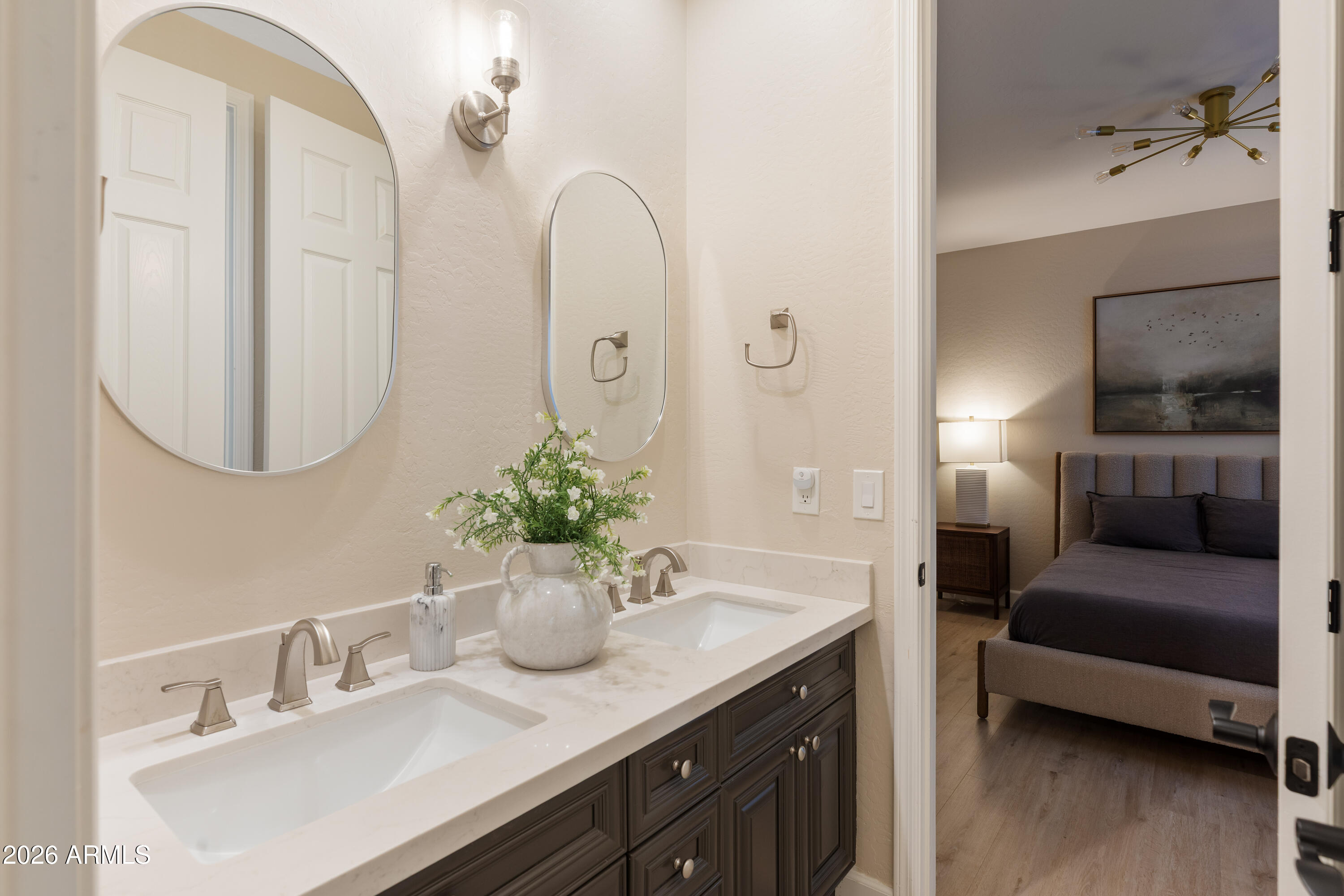 2517 South Constellation Way Gilbert, AZ 85295 - Photo 45 of 47 a en suite bathroom with a double vanity sink and a mirror