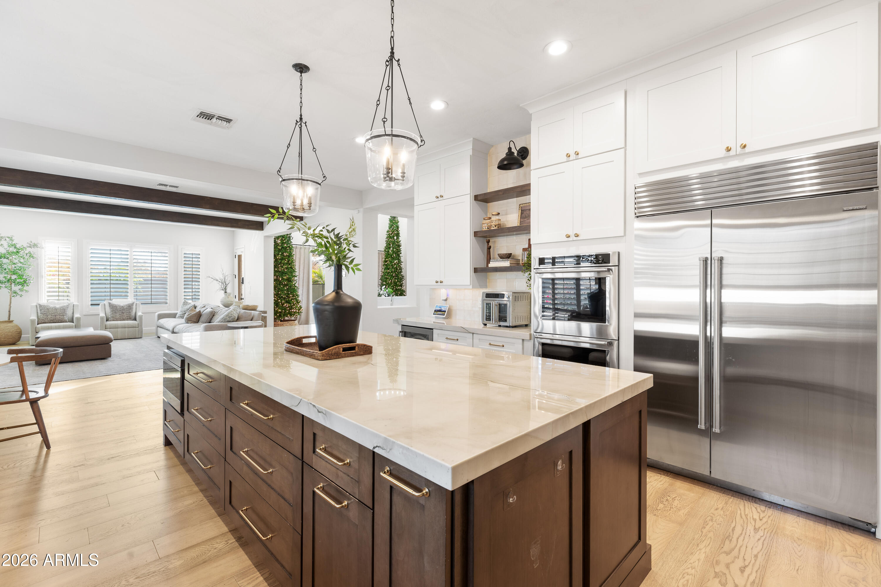 2517 South Constellation Way Gilbert, AZ 85295 - Photo 7 of 47 a kitchen with stainless steel appliances granite countertop a sink a refrigerator and a view of living room