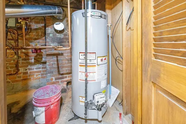 a bathroom with a granite countertop shower and a toilet
