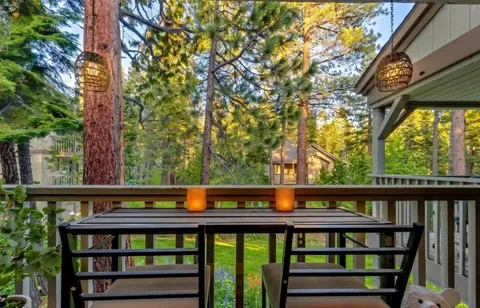 a view of a large wooden bench in a yard