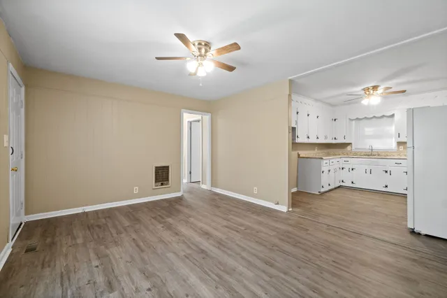 a view of an empty room with a window