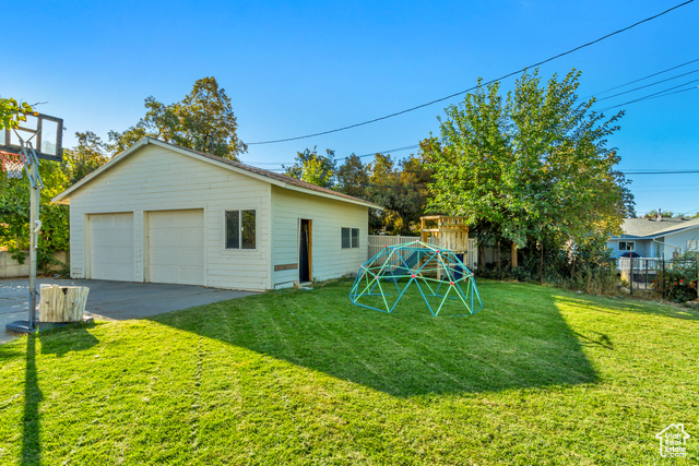 360 East Center Street Centerville, UT 84014 - Photo 10 of 41 View of yard featuring an outdoor structure and a detached garage