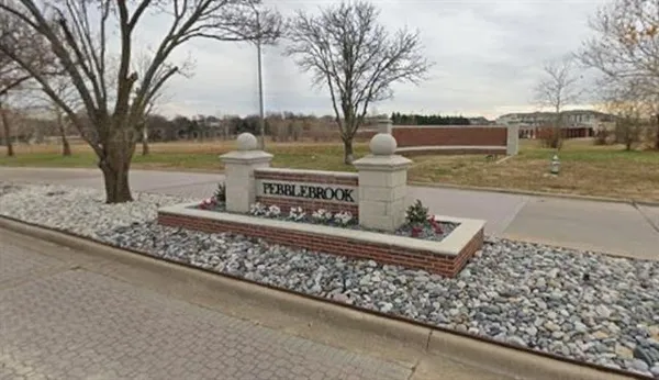 a sign on the side of a street