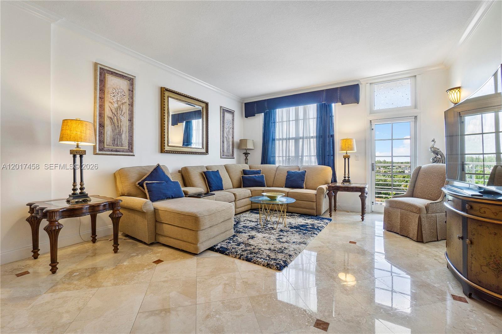 2851 South Ocean Boulevard, Unit 7U Boca Raton, FL 33432 - Photo 11 of 15 a living room with furniture and a lamp