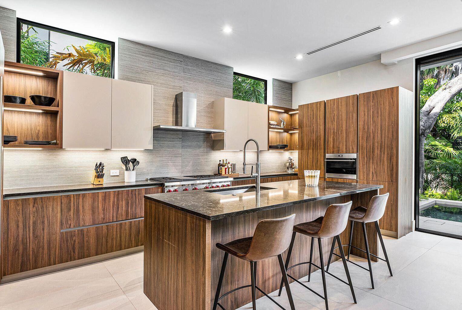 775 Park Drive West Boca Raton, FL 33432 - Photo 15 of 31 a kitchen with a sink a stove a refrigerator and wooden cabinets